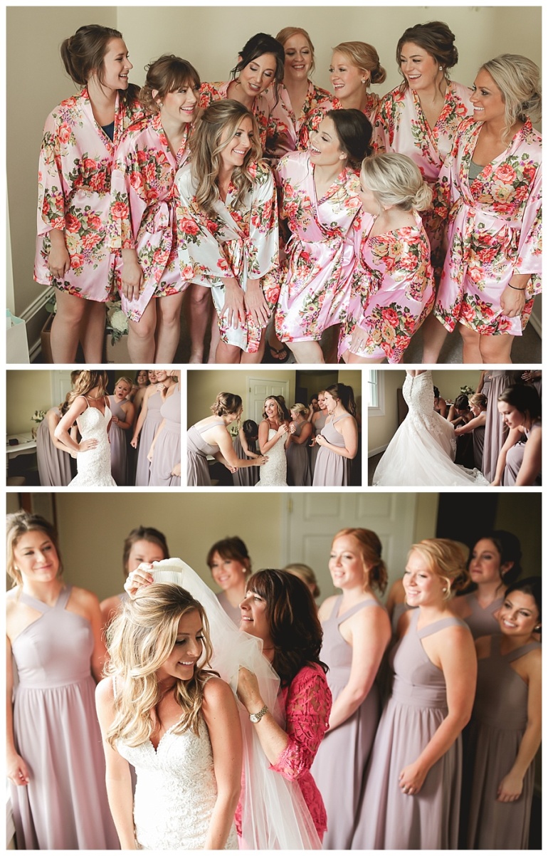 bridal party in robes and dressing bride veil